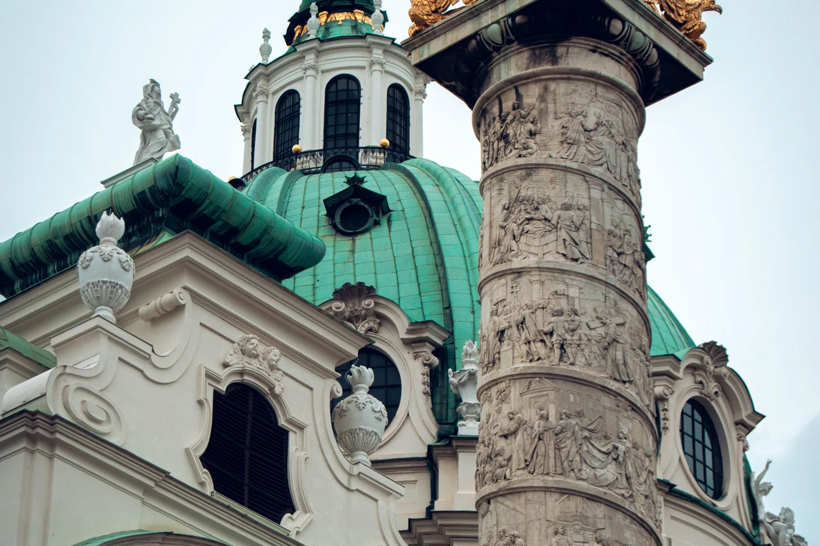 Baroque facade and green dome of Karlskirche church in Vienna